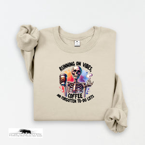Beige sweatshirt with skeleton design and text on a white background