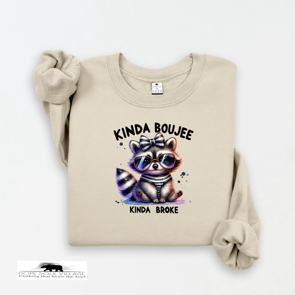Beige sweatshirt with a raccoon graphic and text on a white background