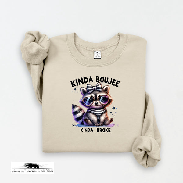 Beige sweatshirt with a raccoon graphic and text on a white background
