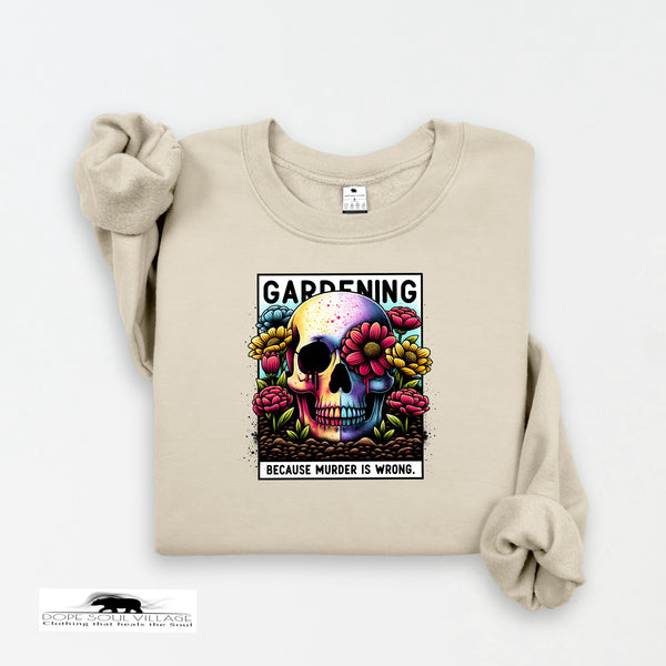 Beige sweatshirt with a colorful skull design and text on a white background