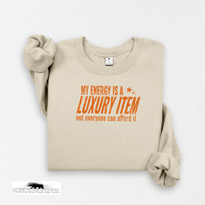 Beige sweatshirt with orange text on a white background