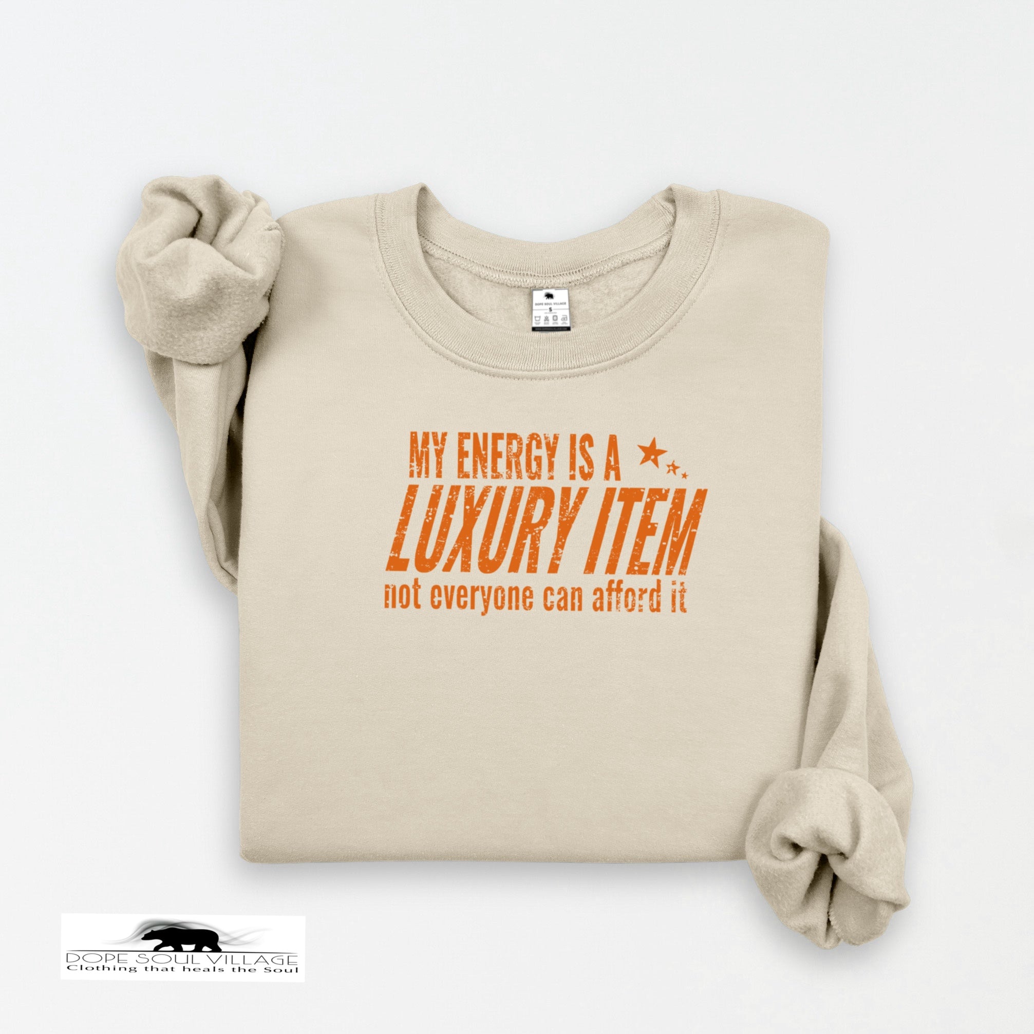 Beige sweatshirt with orange text on a white background