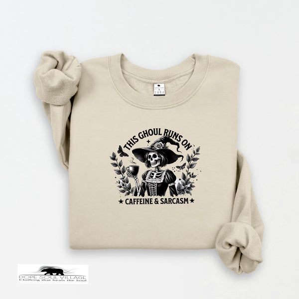 Beige sweatshirt with a graphic design featuring a skeleton and text on a white background.