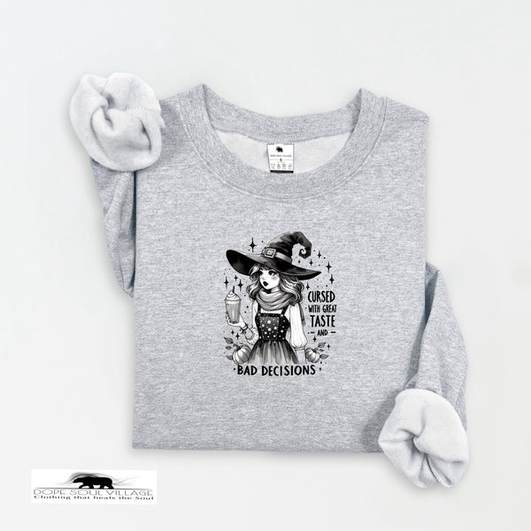 Gray sweatshirt with a witch graphic and text on a white background