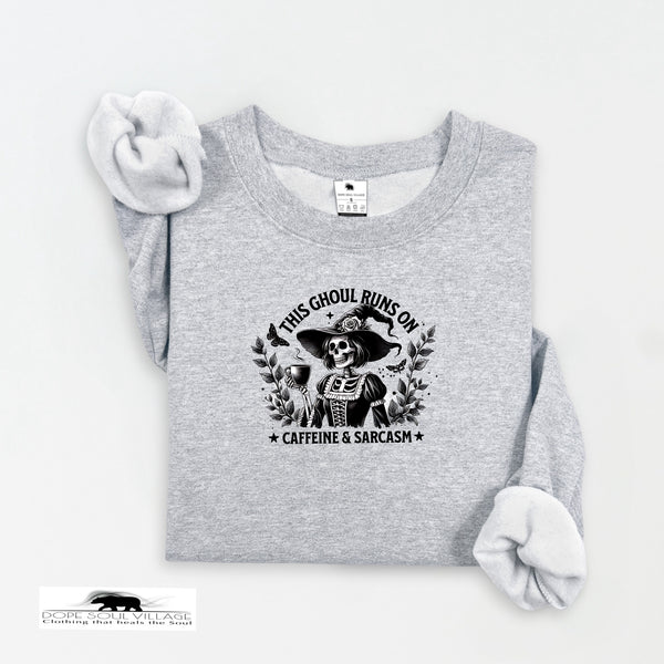 Gray sweatshirt with a graphic design and text on a white background