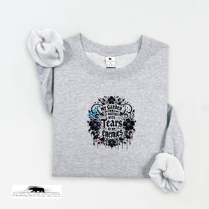 Gray sweatshirt with floral design and text on a white background