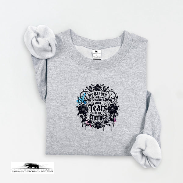 Gray sweatshirt with floral design and text on a white background