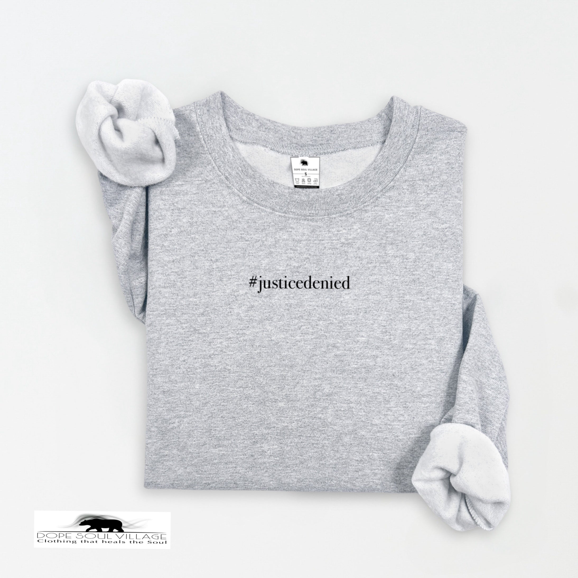 Gray sweatshirt with '#justicedenied' text on a white background rebecca goodwin