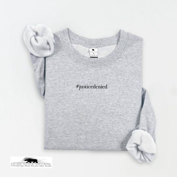 Gray sweatshirt with '#justicedenied' text on a white background rebecca goodwin