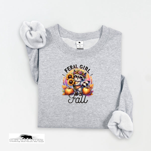 Gray sweatshirt with a graphic design featuring a raccoon, sunflowers, and pumpkins on a white background.
