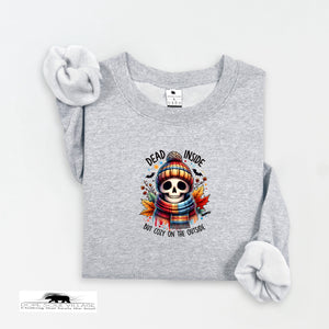 Gray sweatshirt with a skull wearing a hat and scarf graphic on a white background