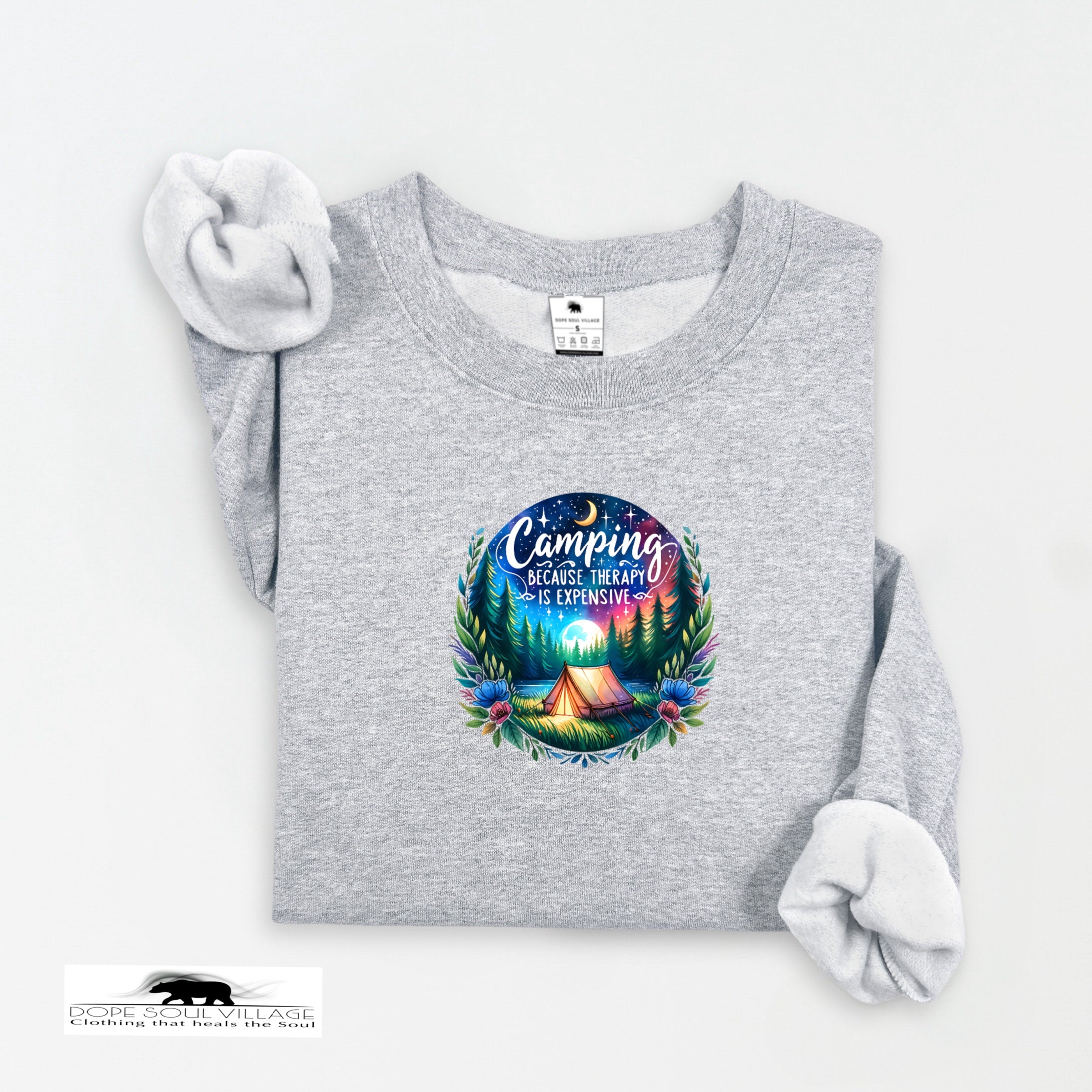 Gray sweatshirt with a colorful camping graphic and text on a white background