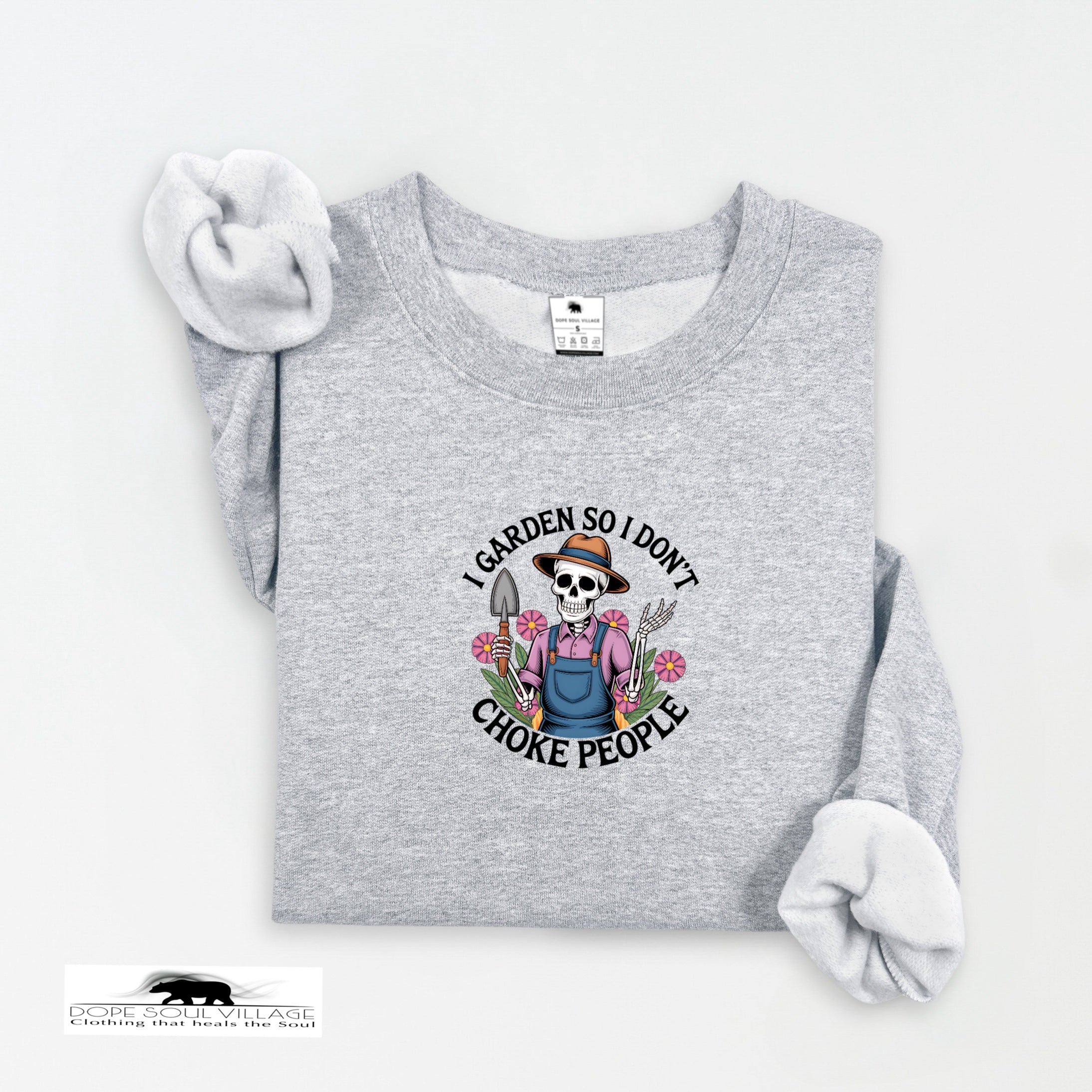 Gray sweatshirt with a skull wearing a hat and overalls graphic and text on a white background