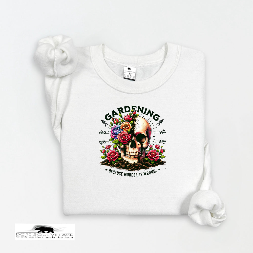 White t-shirt with a skull and floral design on a white background