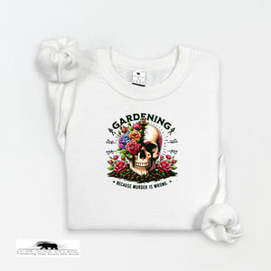 White t-shirt with a skull and floral design on a white background