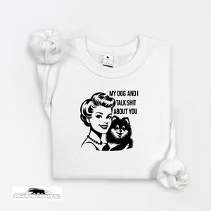 White t-shirt with graphic design of a woman and dog, text 'My dog and I talk sh*t about you', displayed on a white background.