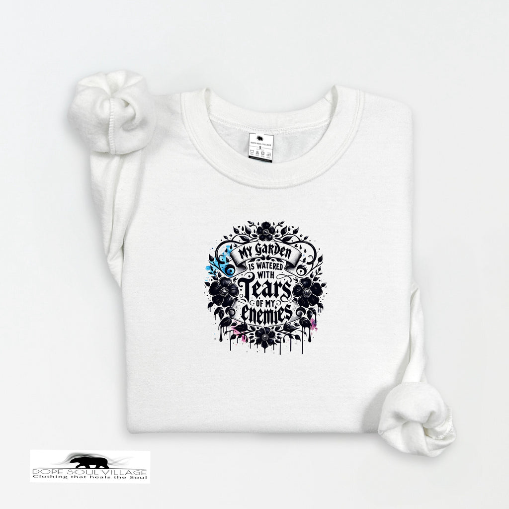 White t-shirt with black floral design and text on a white background