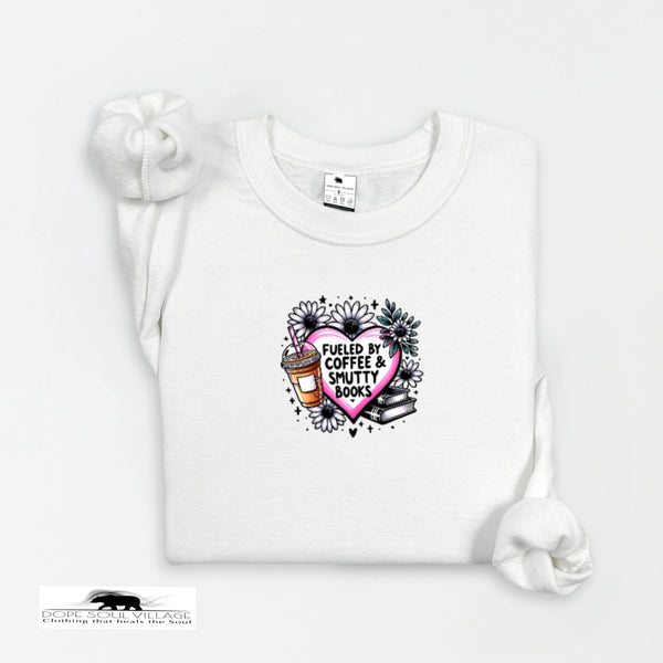 White t-shirt with a graphic design featuring a heart, coffee cup, and books on a white background.