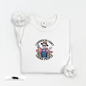 White t-shirt with a graphic design featuring a skeleton gardener and text on a white background.