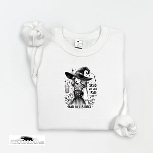 White t-shirt with a witch graphic and text on a white background