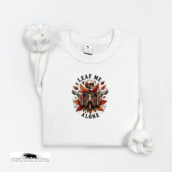 White t-shirt with skeleton and leaf design on a white background