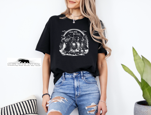 Person wearing a black t-shirt with graphic design and ripped jeans against a white background