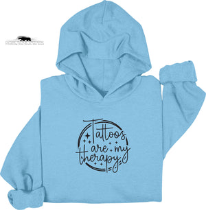 Light blue hoodie with 'Tattoos are my therapy' text on a white background