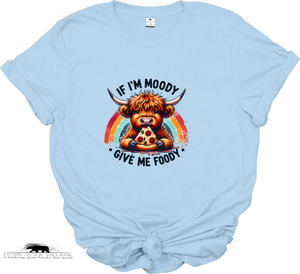 Light blue t-shirt with a cartoon Highland cow holding a pizza and rainbow text on a white background.