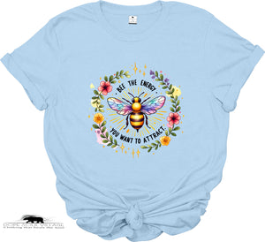 Light blue t-shirt with a colorful bee graphic and text on a white background