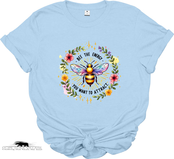 Light blue t-shirt with a colorful bee graphic and text on a white background
