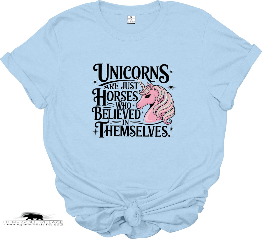 Light blue t-shirt with a unicorn graphic and text on a white background