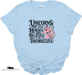 Light blue t-shirt with a unicorn graphic and text on a white background