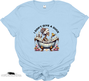 Light blue t-shirt with a graphic design and text 'I Don't Give a Duck' on a white background