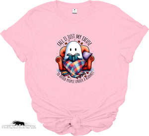 Pink t-shirt with a ghost reading a book graphic and text on a white background