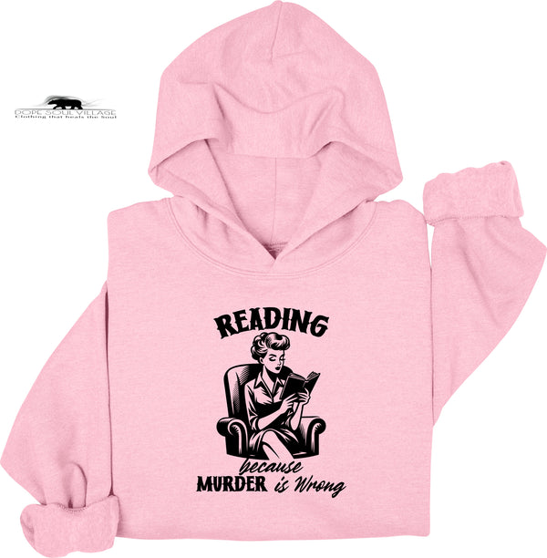 Pink hoodie with a graphic of a woman reading and text 'Reading because murder is wrong' on a white background.