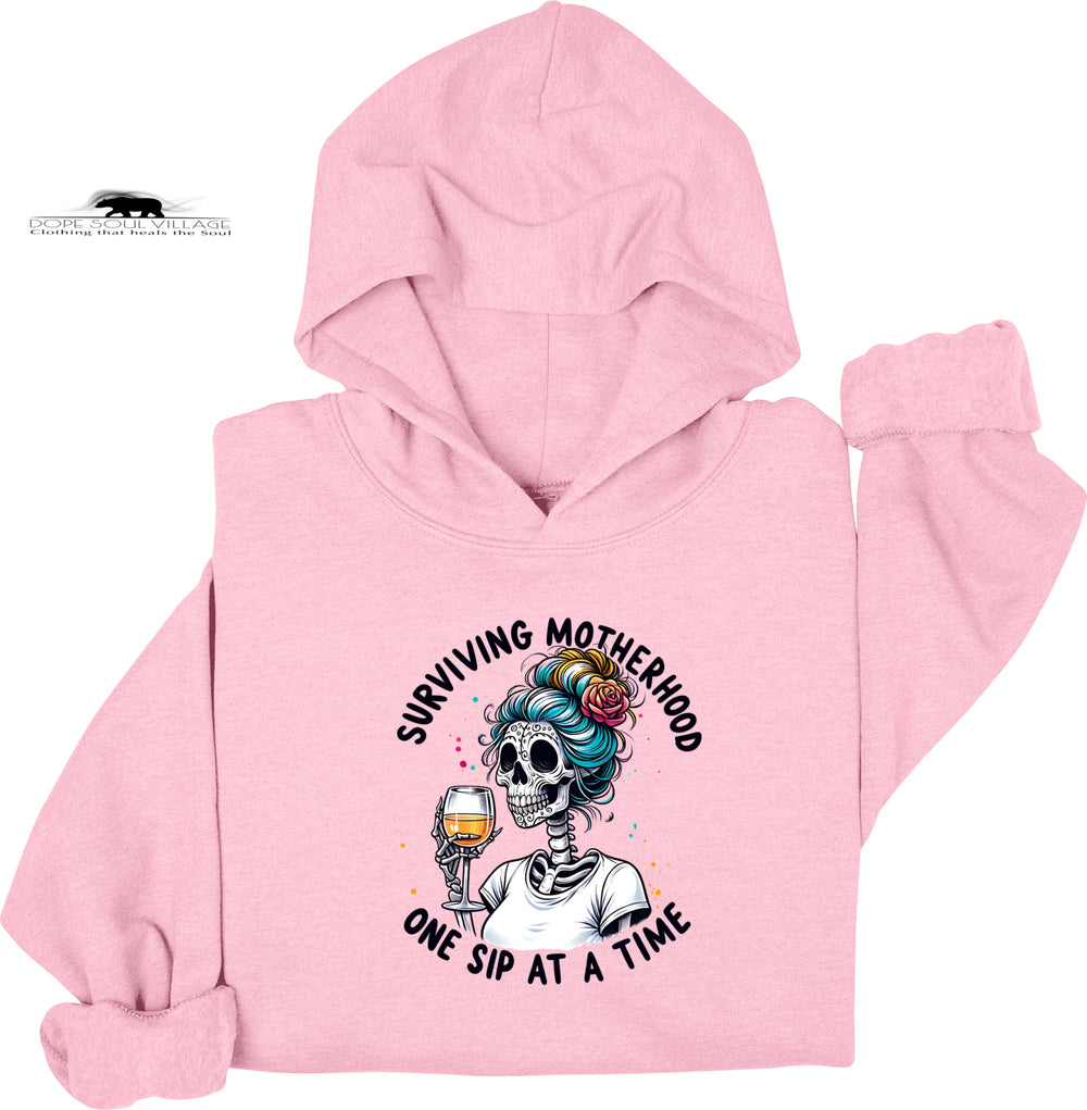 Pink hoodie with a skeleton design and text on a white background