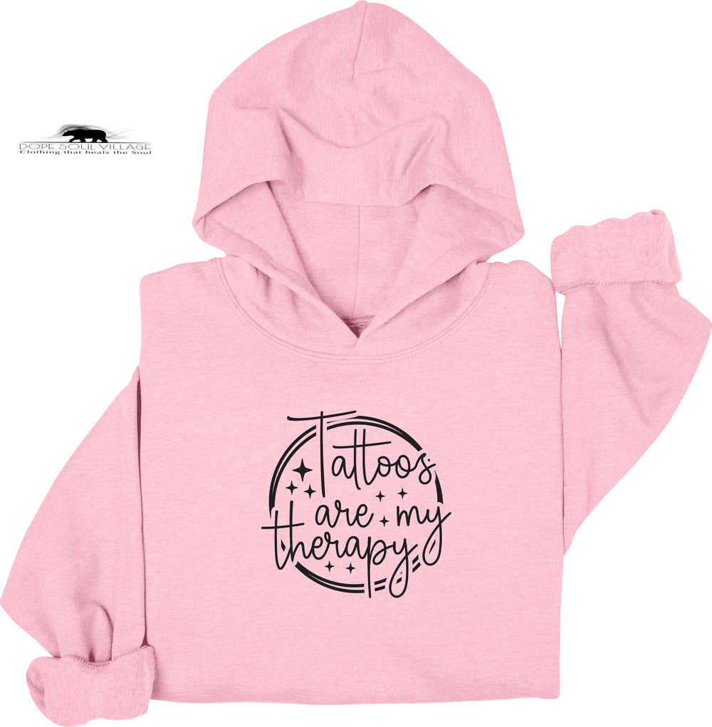 Pink hoodie with 'Tattoos are my therapy' text on a white background
