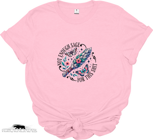 Pink t-shirt with a graphic design and text on a white background