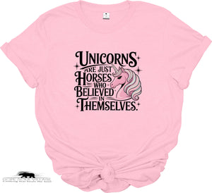Pink t-shirt with unicorn graphic and text on a white background