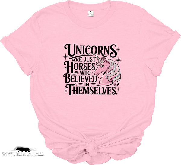 Pink t-shirt with unicorn graphic and text on a white background