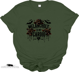 Green t-shirt with roses and text 'Melancholy is my Cardio' on a white background