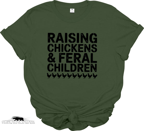 Green t-shirt with black text 'RAISING CHICKENS & FERAL CHILDREN' on a white background