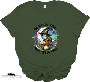 Green t-shirt with a witch and mushroom graphic and text on a white background
