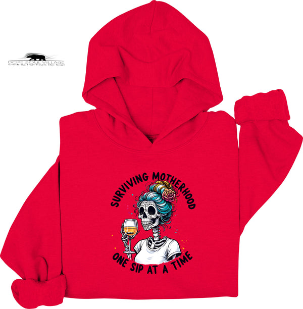 Red hoodie with a graphic design featuring a skeleton and text on a white background