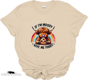 “If I’m Moody, Give Me Foody” t-shirt. Highland cow graphic, sustainable materials. Fun, cheeky tee perfect for animal lovers and ethical fashion fans.