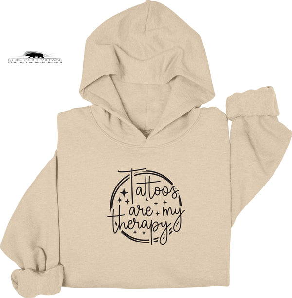 Beige hoodie with 'Tattoos are my therapy' text on a white background