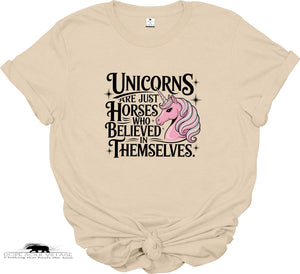 Beige t-shirt with a unicorn graphic and text on a white background