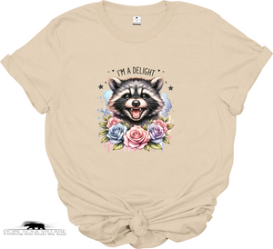 Beige t-shirt with a raccoon graphic and floral design on a white background