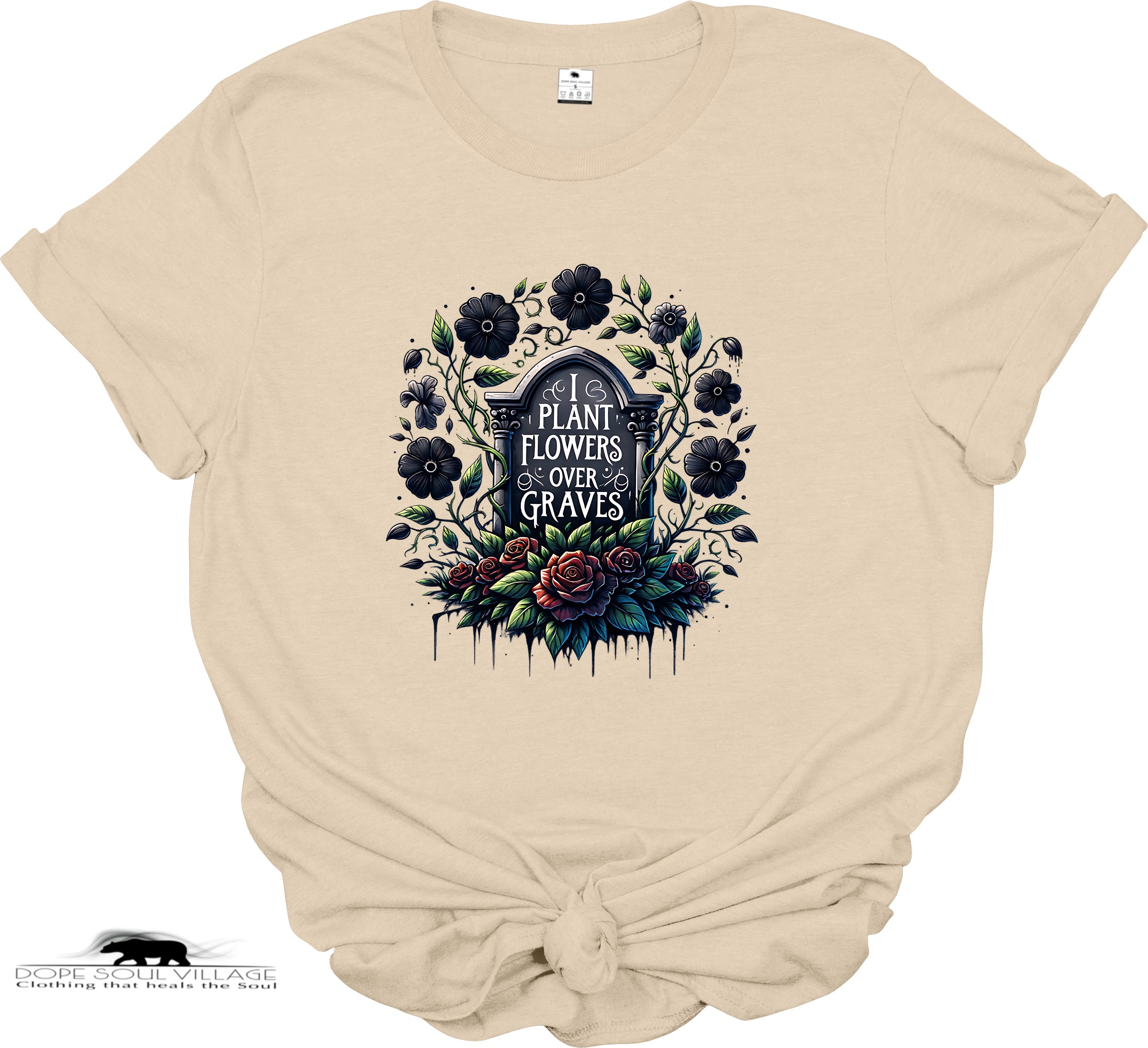 Beige t-shirt with floral and gravestone design on a white background