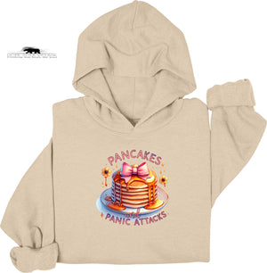 Beige hoodie with a colorful graphic of pancakes and text on a white background